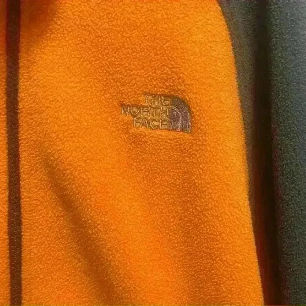 The North Face - orange and gray fleece jacket